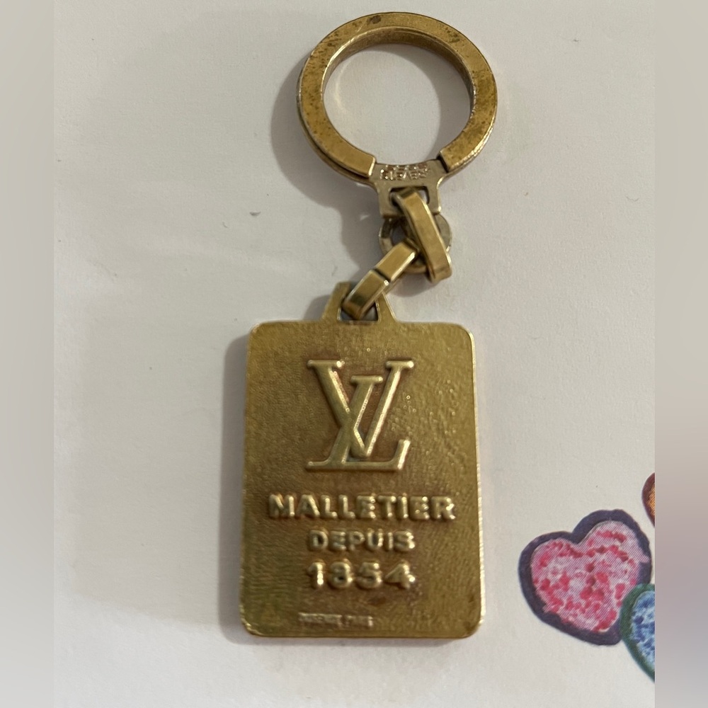 LOUIS VUITTON 1854 MALLETIER DEPUIS KEY CHAIN OR BAG CHARM